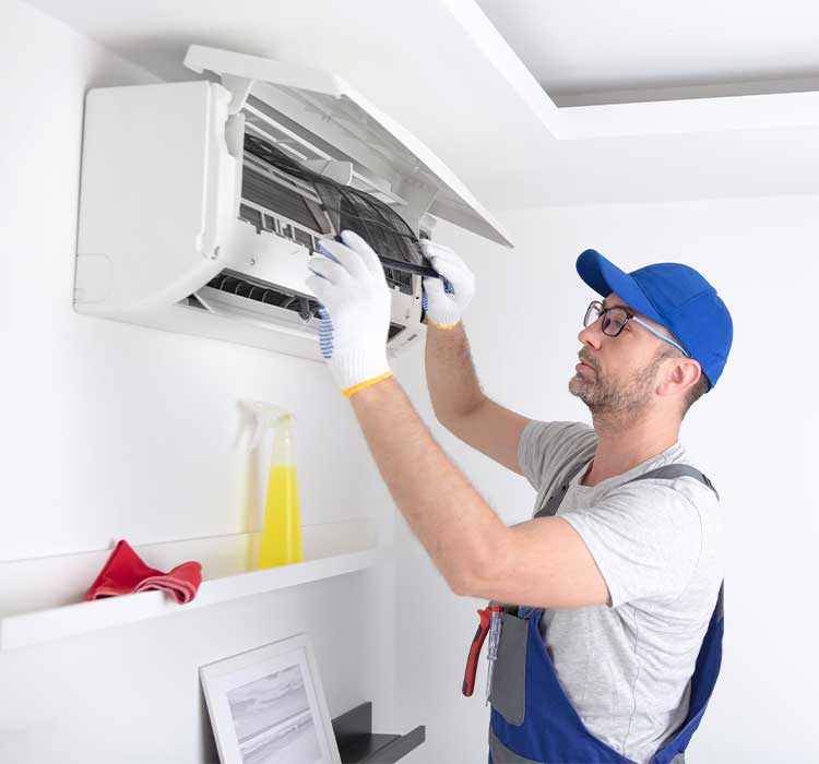 Electrician man repair and maintenance air conditioner