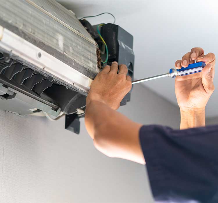 Repairman fix air conditioning systems, Technicians man using screwdrivers service for repair and maintenance of air conditioners.